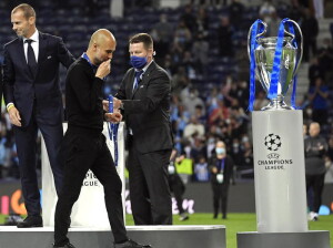 epa09235983 Manchester City manager Pep Guardiola (2-L) reacts after the UEFA Champions League final between Manchester City and Chelsea FC in Porto, Portugal, 29 May 2021. EPA/Pierre-Philippe Marcou / POOL